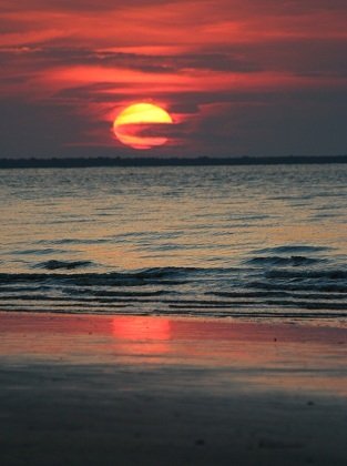 red sky sunset over water