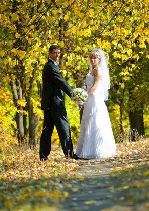 newlyweds outside in autumn