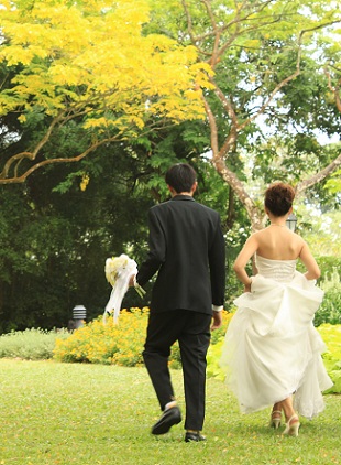 newlyweds walking outside