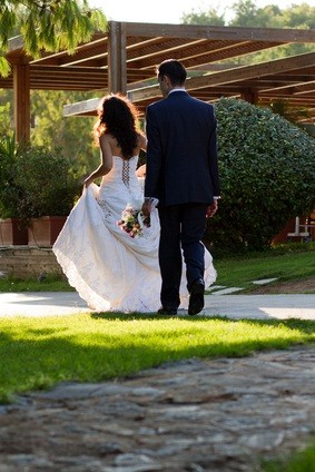 newlyweds walking outdoors