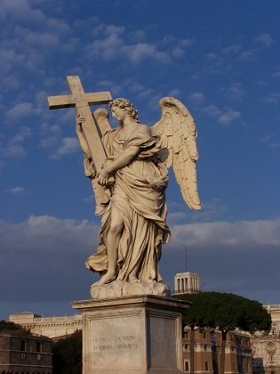 angel holding a cross