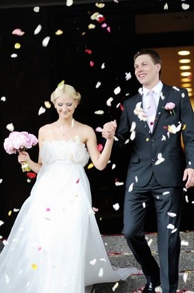 newlyweds and rose petals