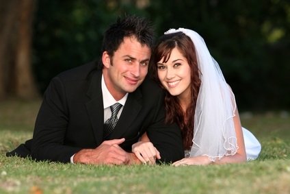 newlyweds on grass