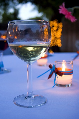 votive candle and champagne in a glass