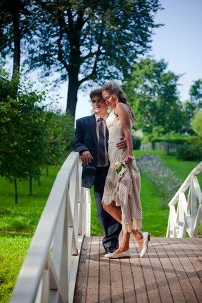 bride and groom on bridge